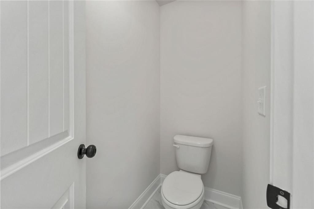769 Dawn Place Alto, GA 30510 - Photo 37 of 40 a white toilet sitting next to a white wall