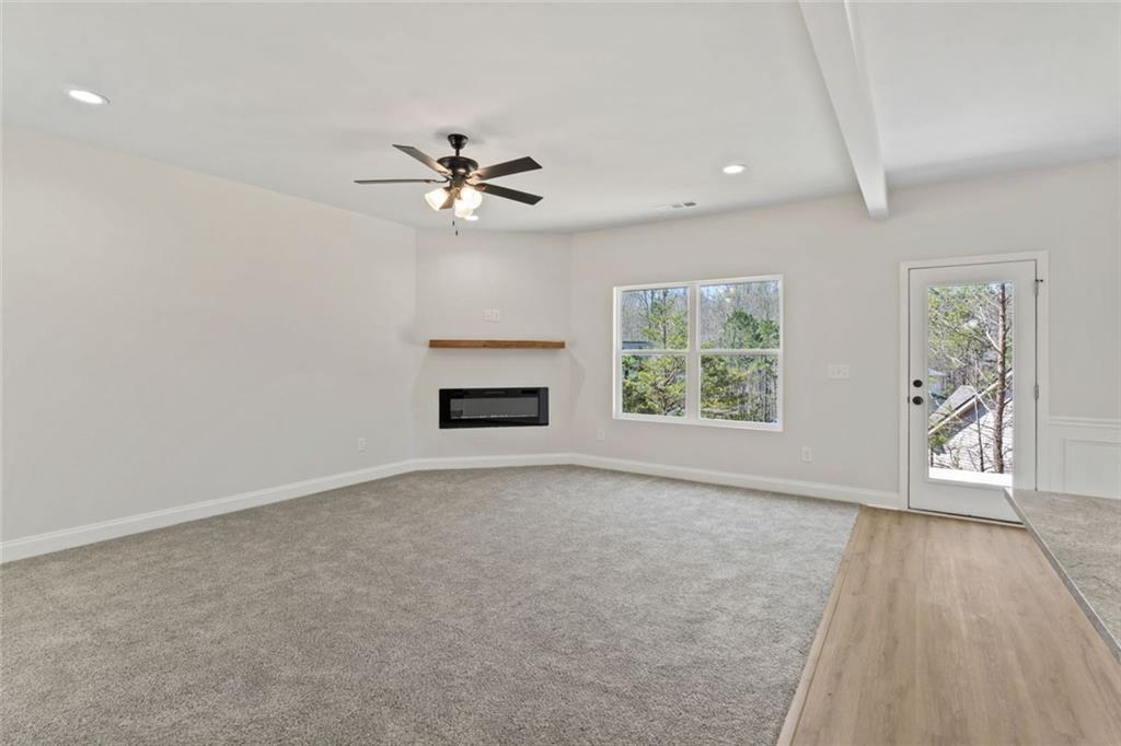 769 Dawn Place Alto, GA 30510 - Photo 7 of 40 wooden floor in an empty room with a window