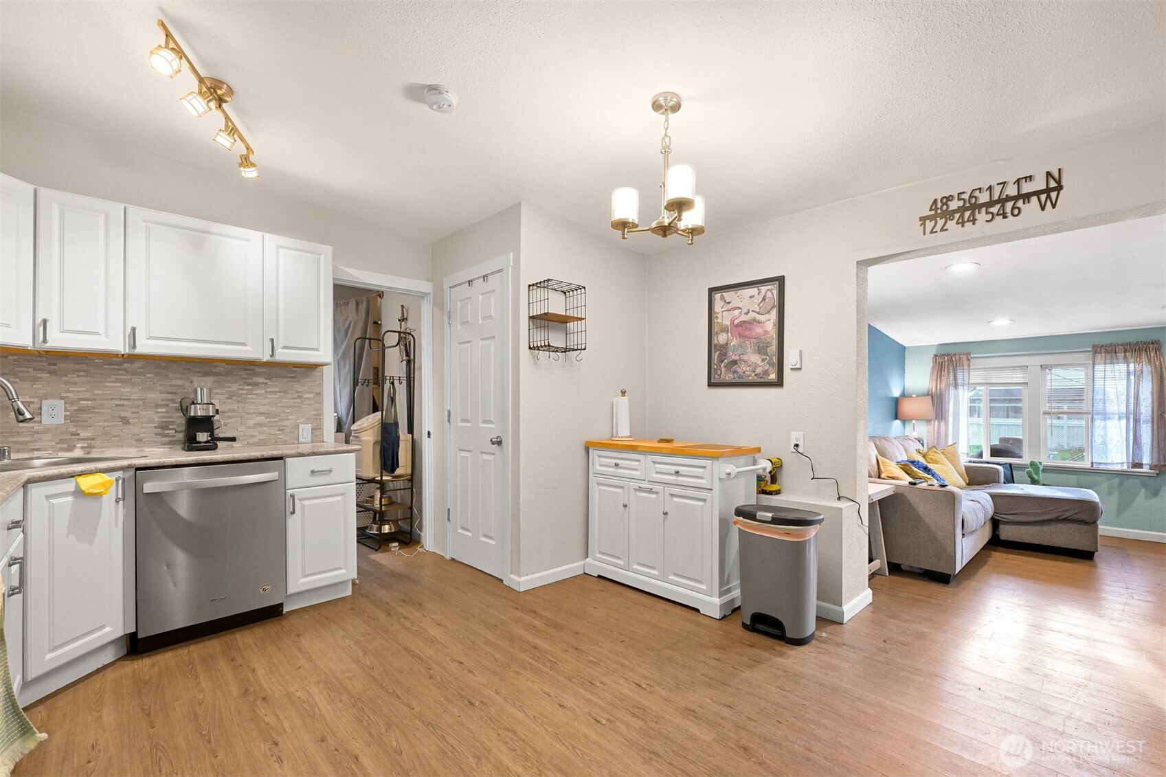 8153 Harborview Road Birch Bay, WA 98230 - Photo 12 of 28 a large white kitchen with stainless steel appliances granite countertop a stove and wooden floor
