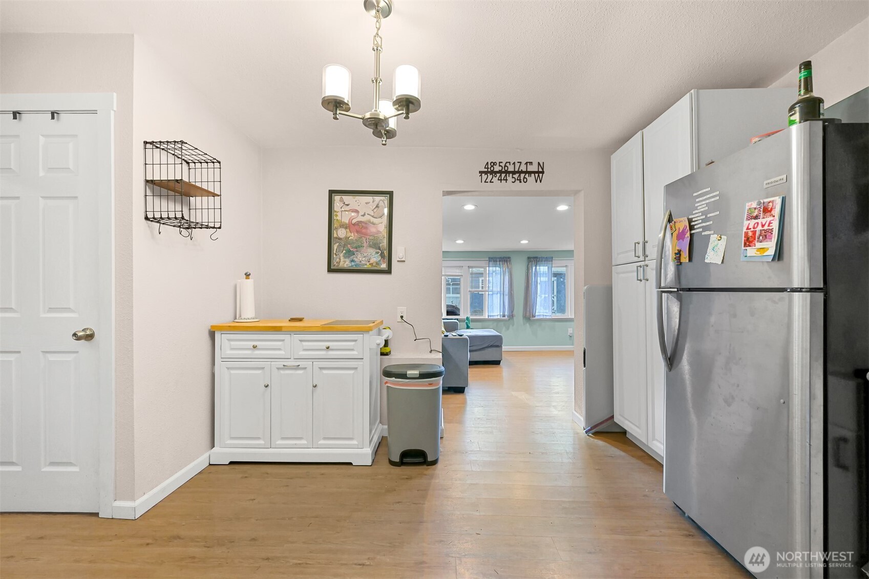 8153 Harborview Road Birch Bay, WA 98230 - Photo 13 of 28 a view of a hallway with workspace and a refrigerator
