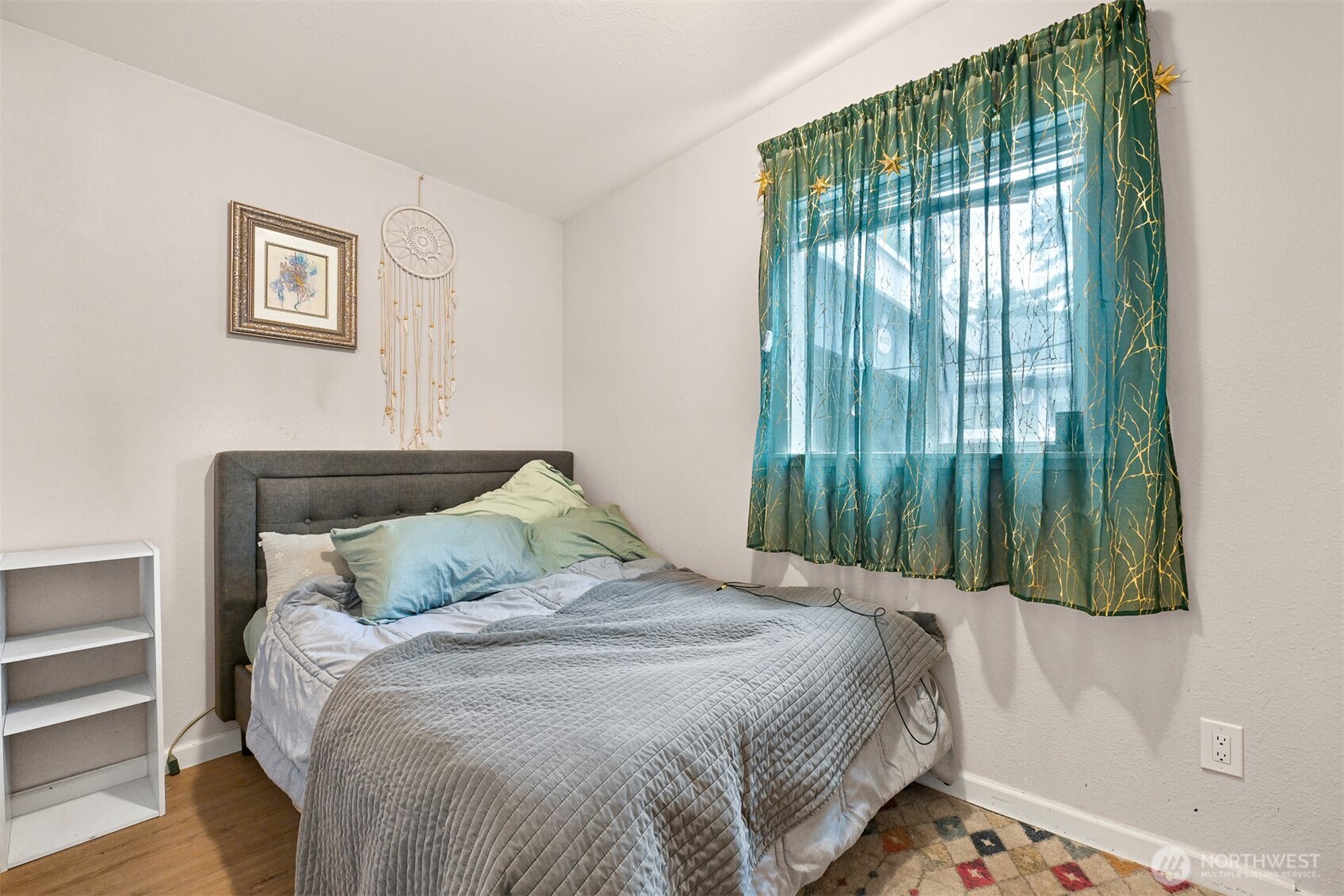 8153 Harborview Road Birch Bay, WA 98230 - Photo 15 of 28 a bedroom with a bed and a painting on the wall