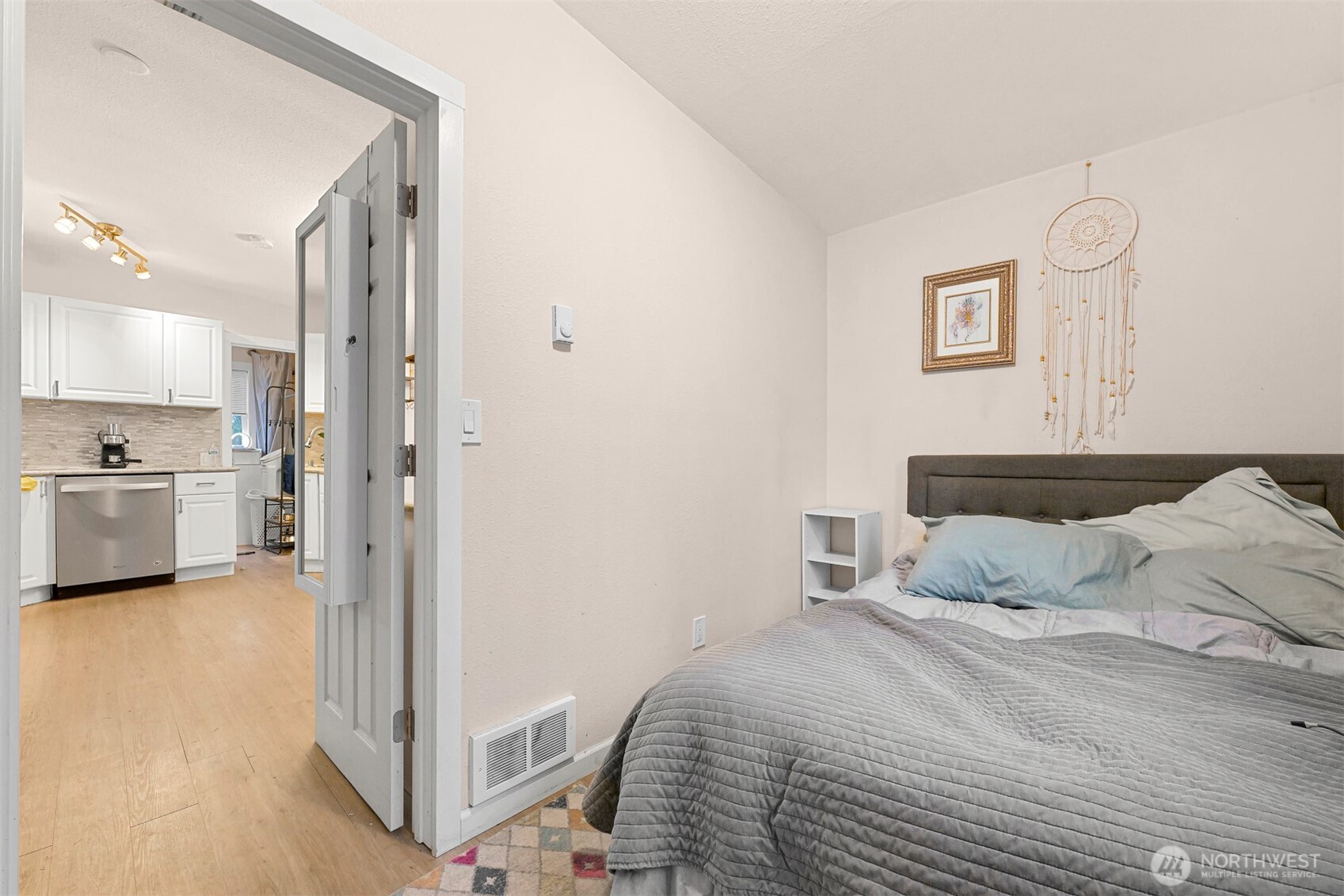 8153 Harborview Road Birch Bay, WA 98230 - Photo 16 of 28 a bedroom with a bed and a view of kitchen