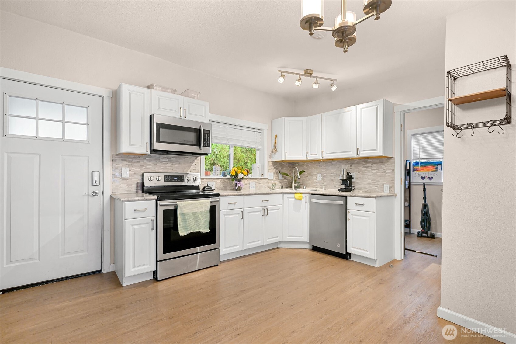 8153 Harborview Road Birch Bay, WA 98230 - Photo 2 of 28 a kitchen with stove cabinets and refrigerator
