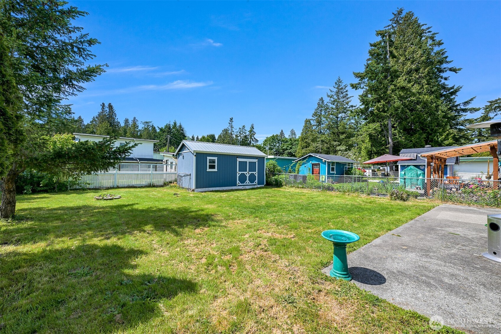 8153 Harborview Road Birch Bay, WA 98230 - Photo 24 of 28 a front view of a house with a garden