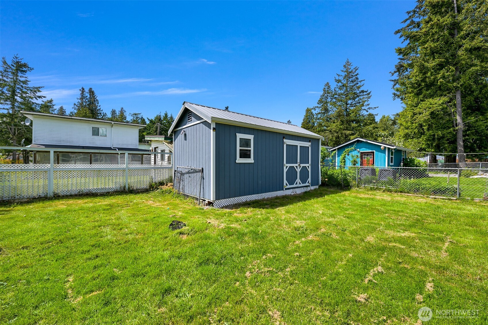 8153 Harborview Road Birch Bay, WA 98230 - Photo 26 of 28 a view of a house with backyard and sitting area
