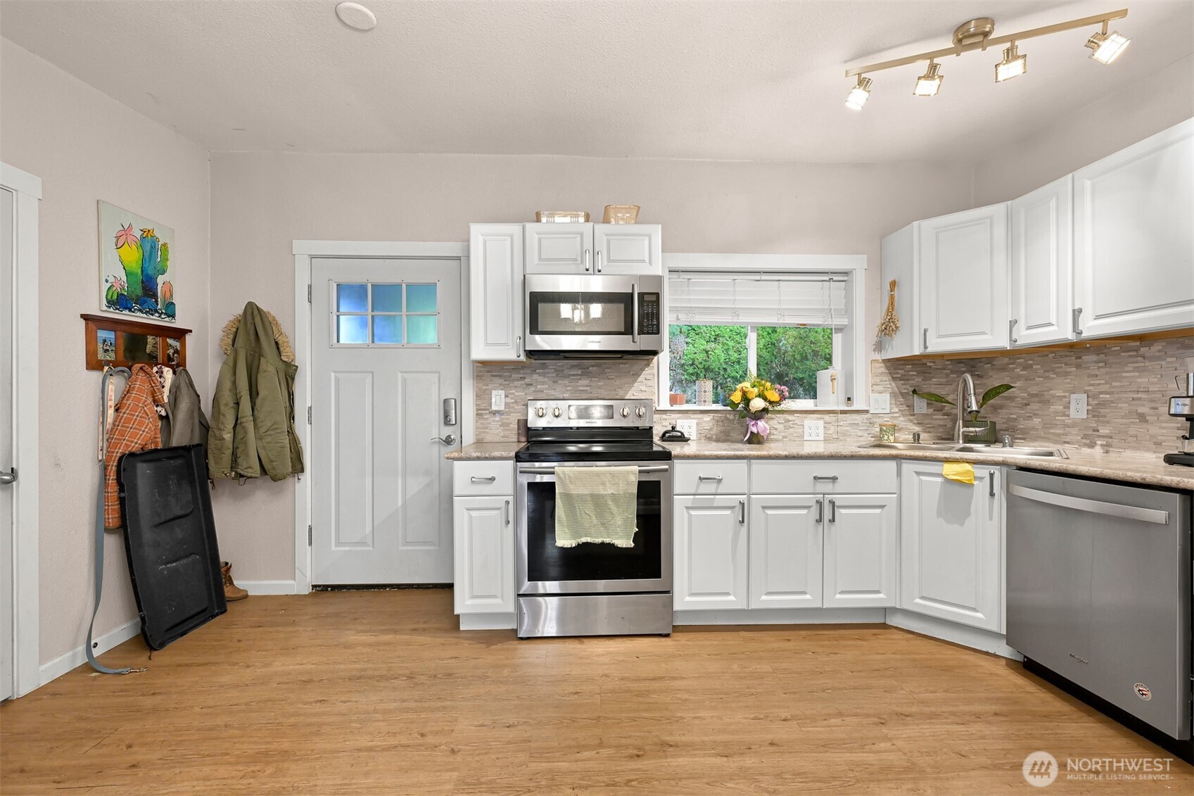 8153 Harborview Road Birch Bay, WA 98230 - Photo 8 of 28 a kitchen with stainless steel appliances granite countertop a refrigerator and a stove top oven