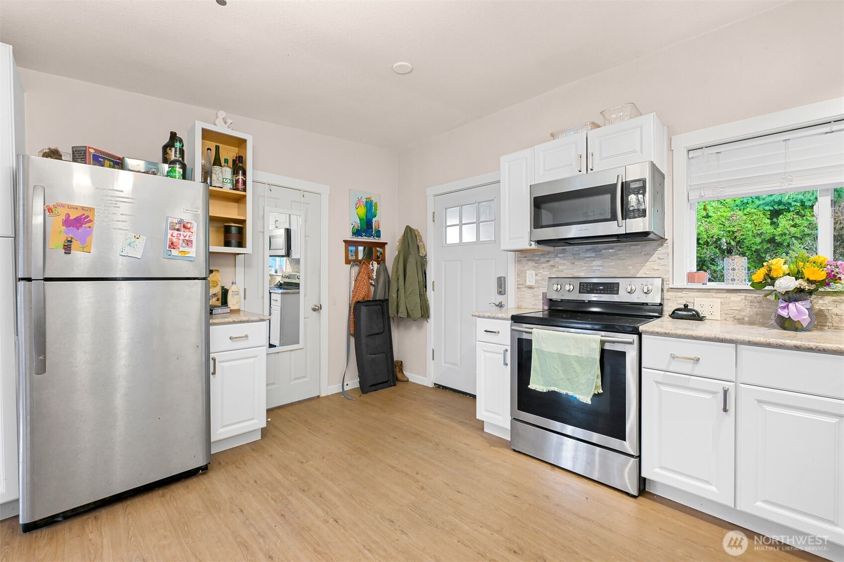 8153 Harborview Road Birch Bay, WA 98230 - Photo 9 of 28 a kitchen with stainless steel appliances a refrigerator stove and microwave