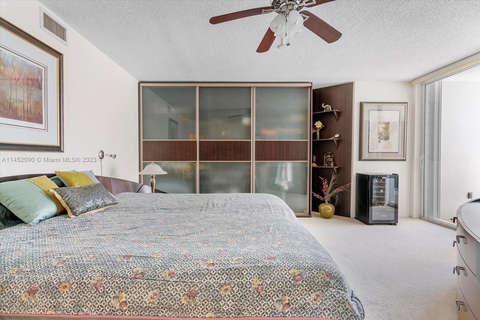 8925 Collins Avenue, Unit 9J Surfside, FL 33154 - Photo 17 of 41 a bedroom with a bed and closet