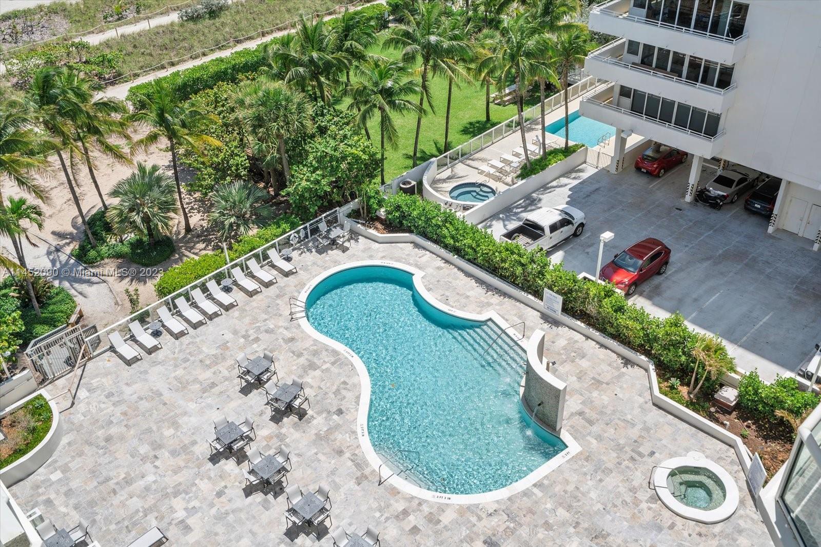 8925 Collins Avenue, Unit 9J Surfside, FL 33154 - Photo 30 of 41 an aerial view of a house with a yard and lake view