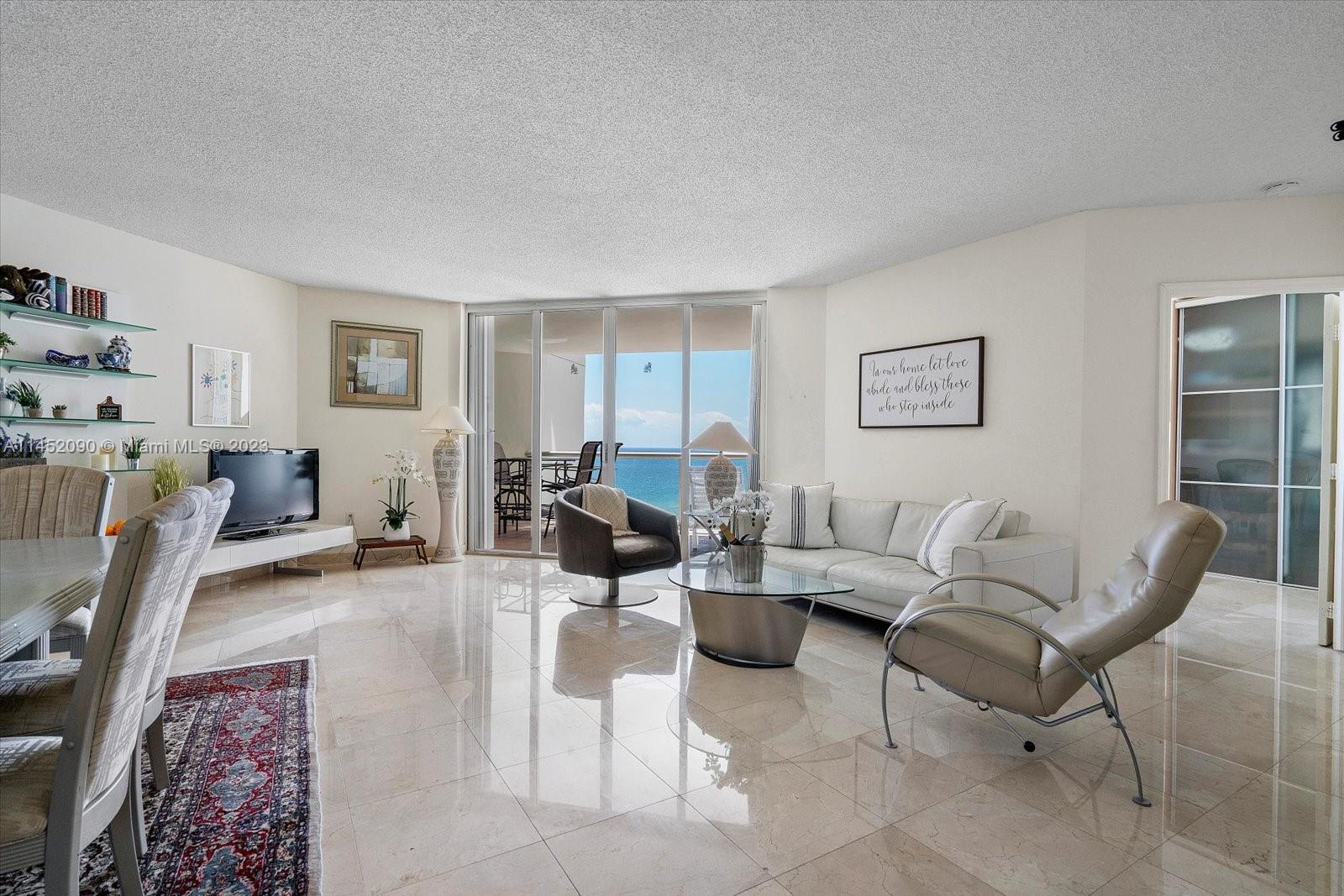 8925 Collins Avenue, Unit 9J Surfside, FL 33154 - Photo 6 of 41 a living room with furniture and a window