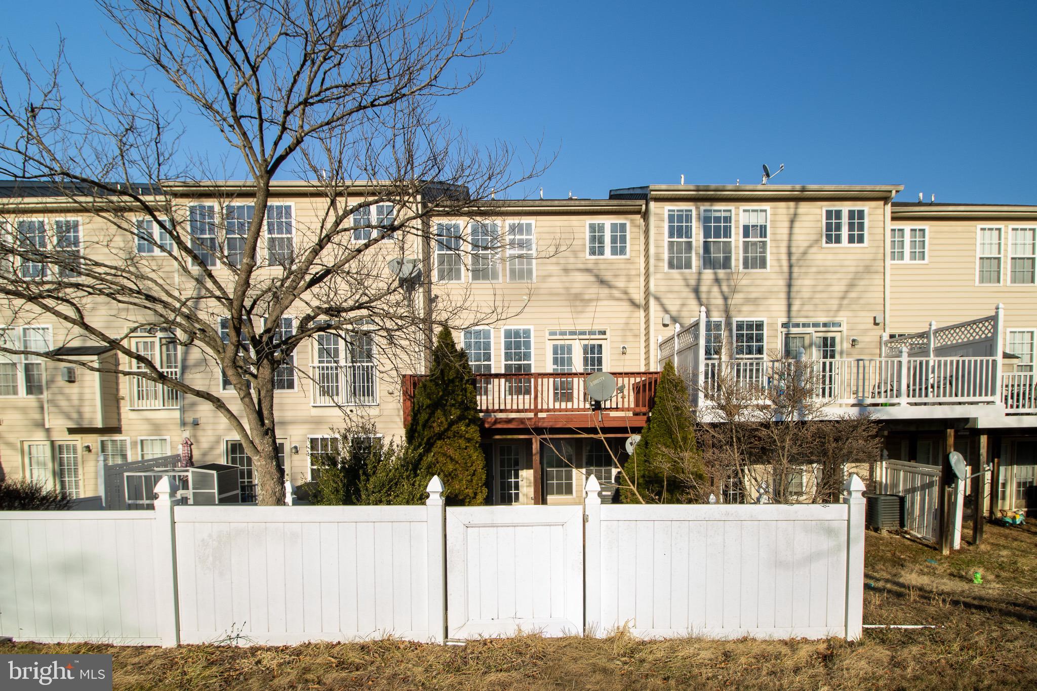 98 Lullwater Way Falling Waters, WV 25419 - Photo 43 of 43 a street view with tall buildings and a street