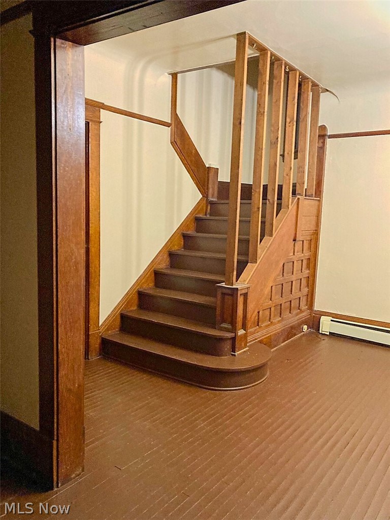 554 Eddy Road Cleveland, OH 44108 - Photo 24 of 32 1st Floor- Stairs with wood finished floors and a baseboard radiator