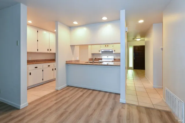 a view of kitchen with wooden floor