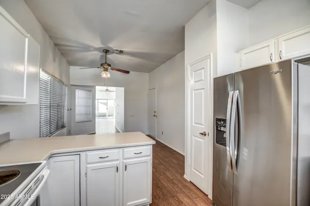 a kitchen with stainless steel appliances a refrigerator and a sink