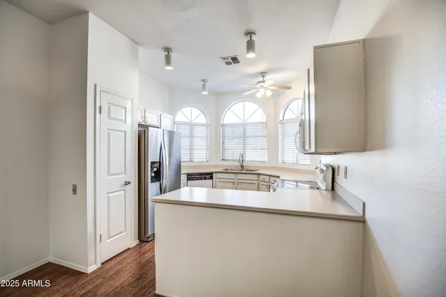 a bathroom with a double vanity sink mirror and double