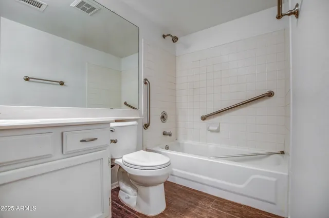 a bathroom with a toilet and a bathtub