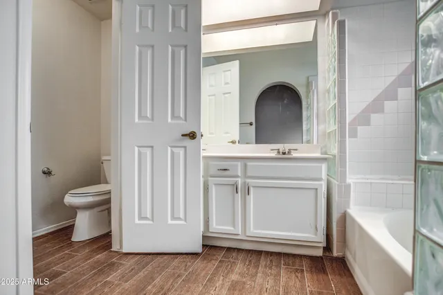 a bathroom with a sink a toilet and a bathtub