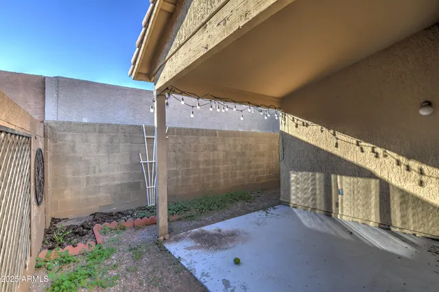 a view of a porch with a table and plants