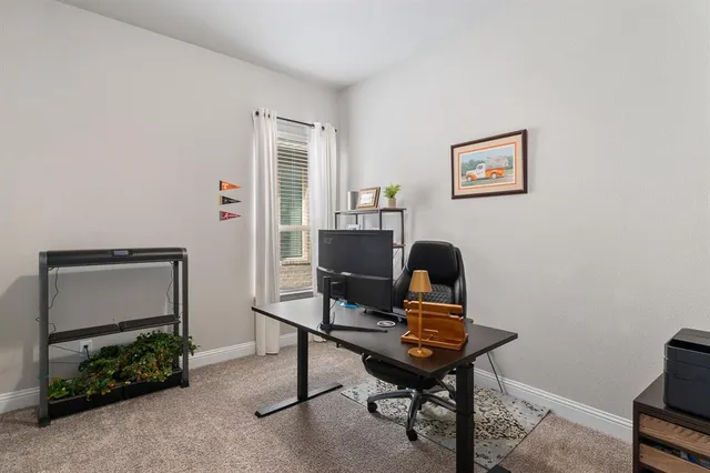 a workspace with furniture and window