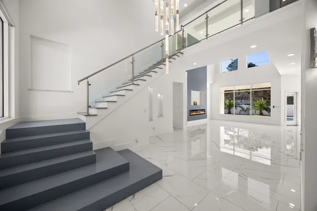 a view of entryway and hall with wooden floor