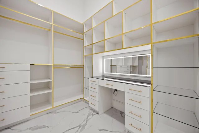 a view of an empty walk in closet