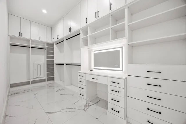 a view of cabinets and window