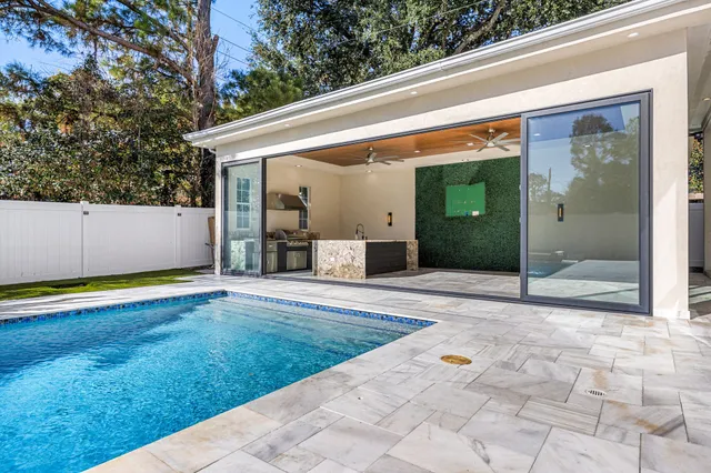 a view of a house with backyard and porch