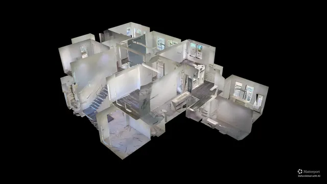 a bed sitting in a bedroom next to a lamp