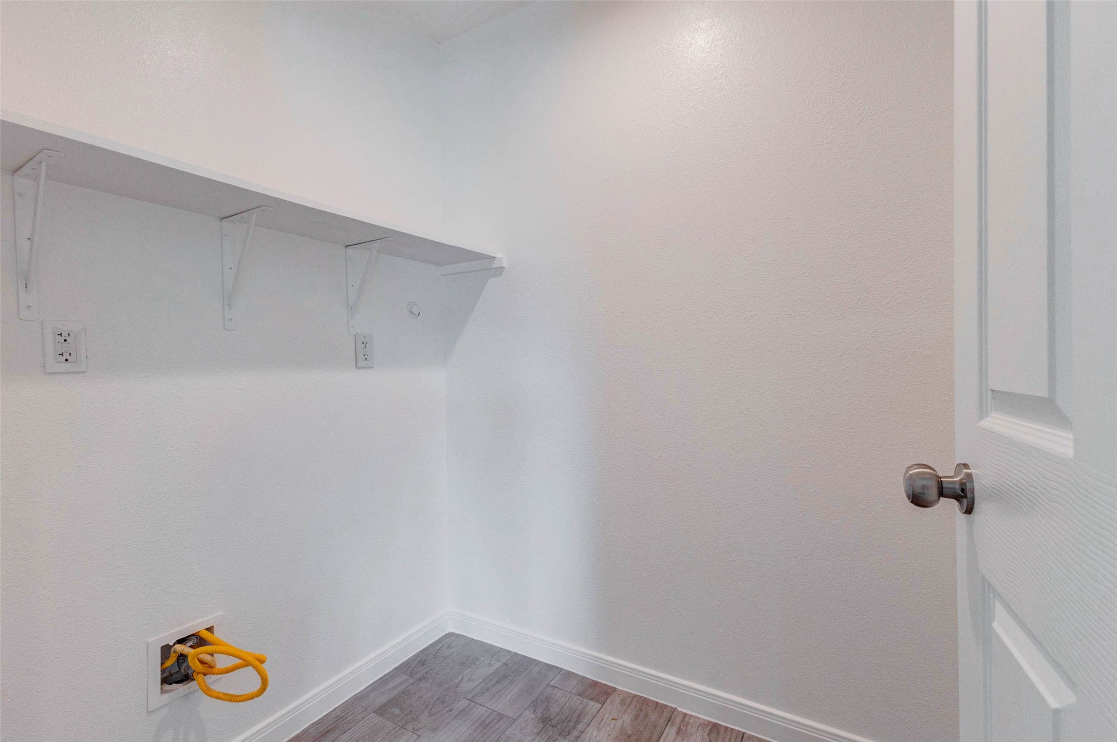 9811 Kerr Street Houston, TX 77029 - Photo 11 of 22 Functional laundry room with dedicated washer and dryer connections, built-in shelving for storage, and a clean, practical layout. This space is designed to keep household tasks organized and efficient, with enough room for additional storage solutions. A convenient and essential feature that adds everyday ease to your routine.