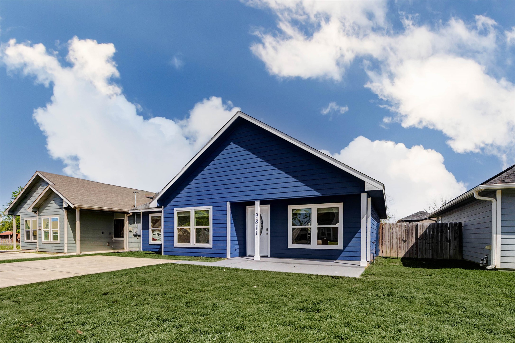 9811 Kerr Street Houston, TX 77029 - Photo 2 of 22 Welcome home to this charming and modern exterior featuring bold blue siding accented by crisp white trim for standout curb appeal. The covered front porch creates a warm and inviting entry, while the extended driveway offers ample parking space. Clean landscaping and a well-maintained lawn complete the look, making this home as attractive outside as it is inside. A perfect blend of style, comfort, and low-maintenance living.