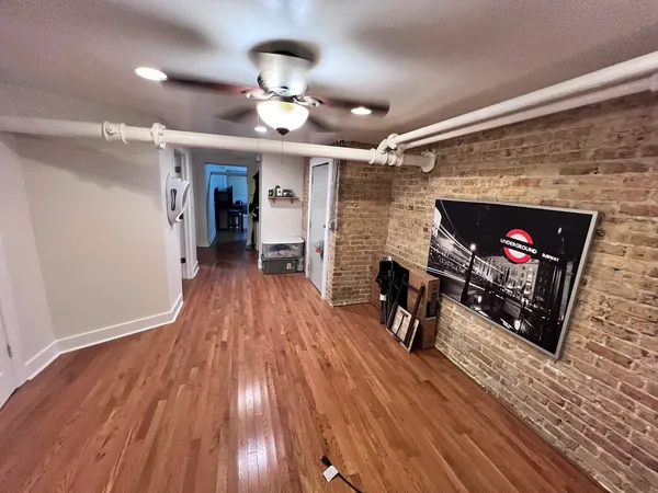 a view of a livingroom with furniture and a fireplace