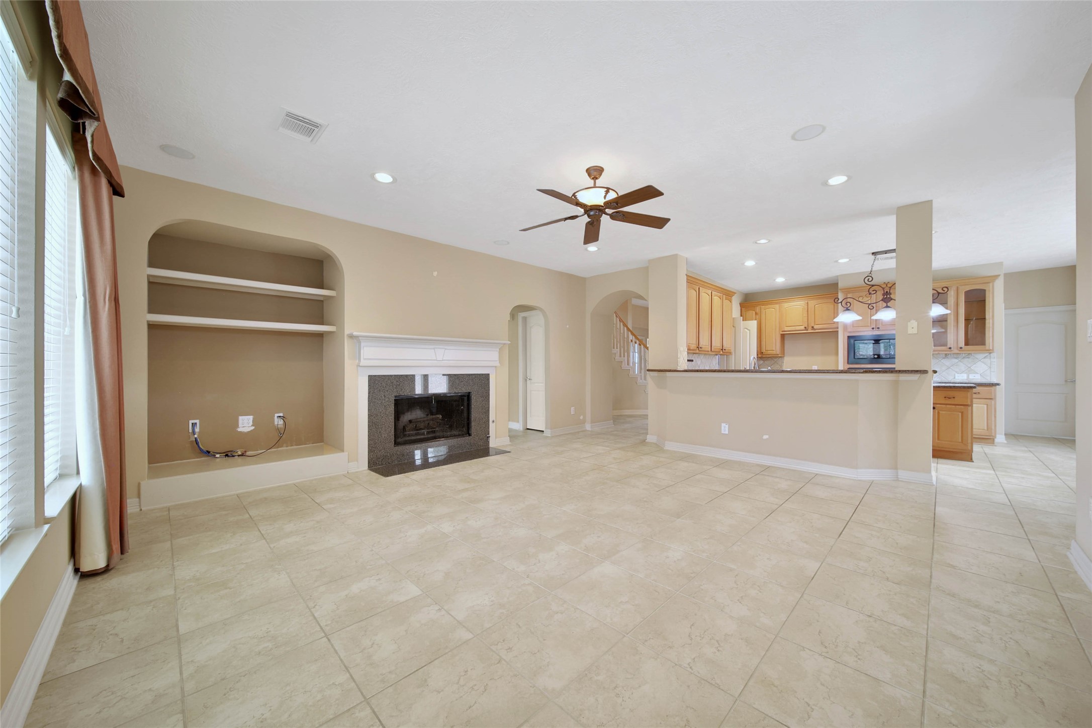 6530 Monte Bello Ridge Lane Houston, TX 77041 - Photo 15 of 43 a view of a kitchen with a sink and a fireplace