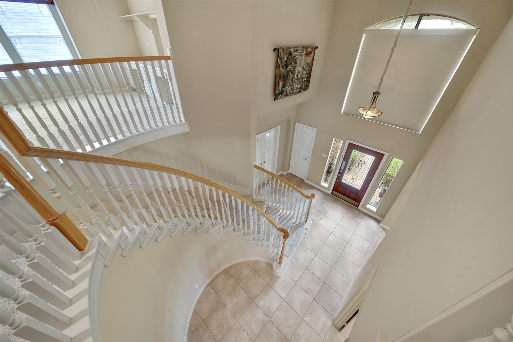 6530 Monte Bello Ridge Lane Houston, TX 77041 - Photo 26 of 43 a view of staircase with white walls and railing