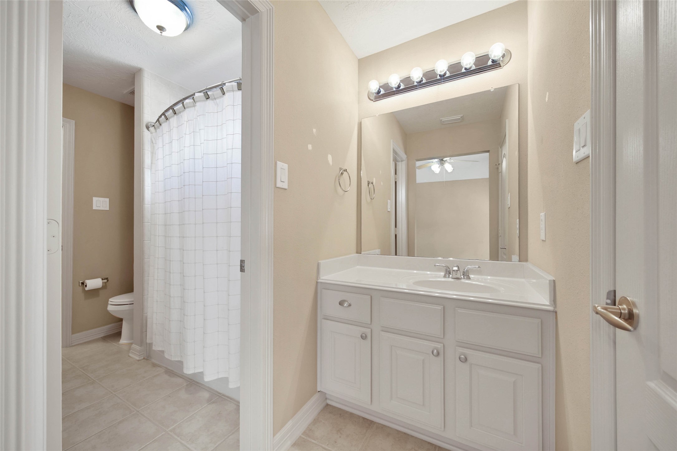 6530 Monte Bello Ridge Lane Houston, TX 77041 - Photo 32 of 43 a bathroom with a double vanity sink mirror and toilet