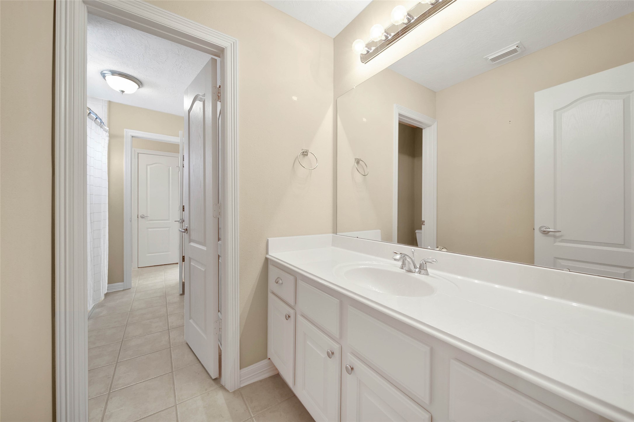 6530 Monte Bello Ridge Lane Houston, TX 77041 - Photo 33 of 43 a bathroom with a sink a mirror and a shower