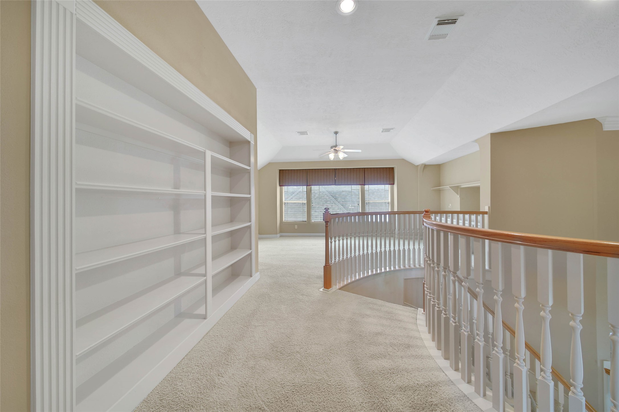 6530 Monte Bello Ridge Lane Houston, TX 77041 - Photo 36 of 43 a view of a hallway with cabinet and a refrigerator