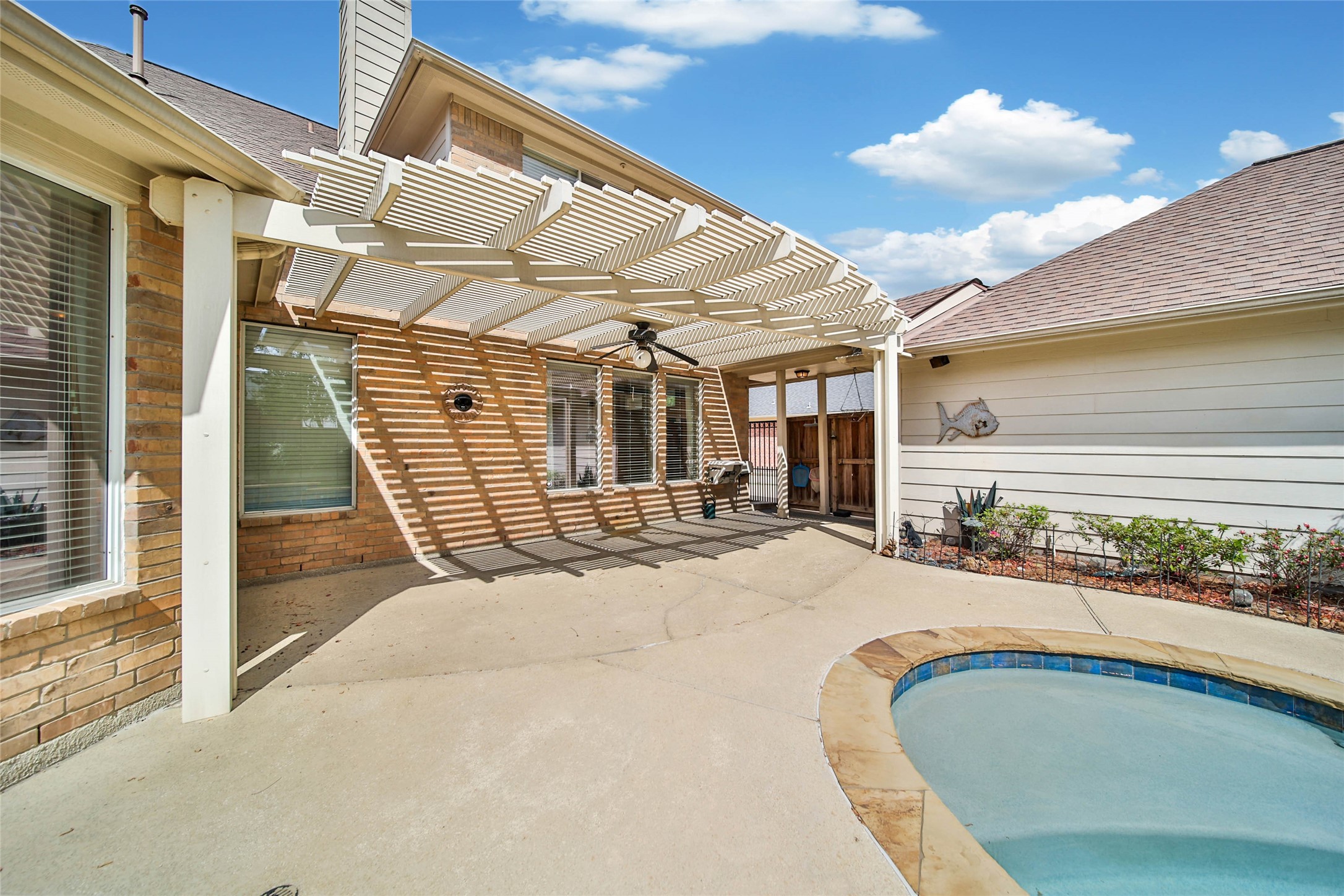 6530 Monte Bello Ridge Lane Houston, TX 77041 - Photo 39 of 43 a swimming pool with outdoor seating and yard