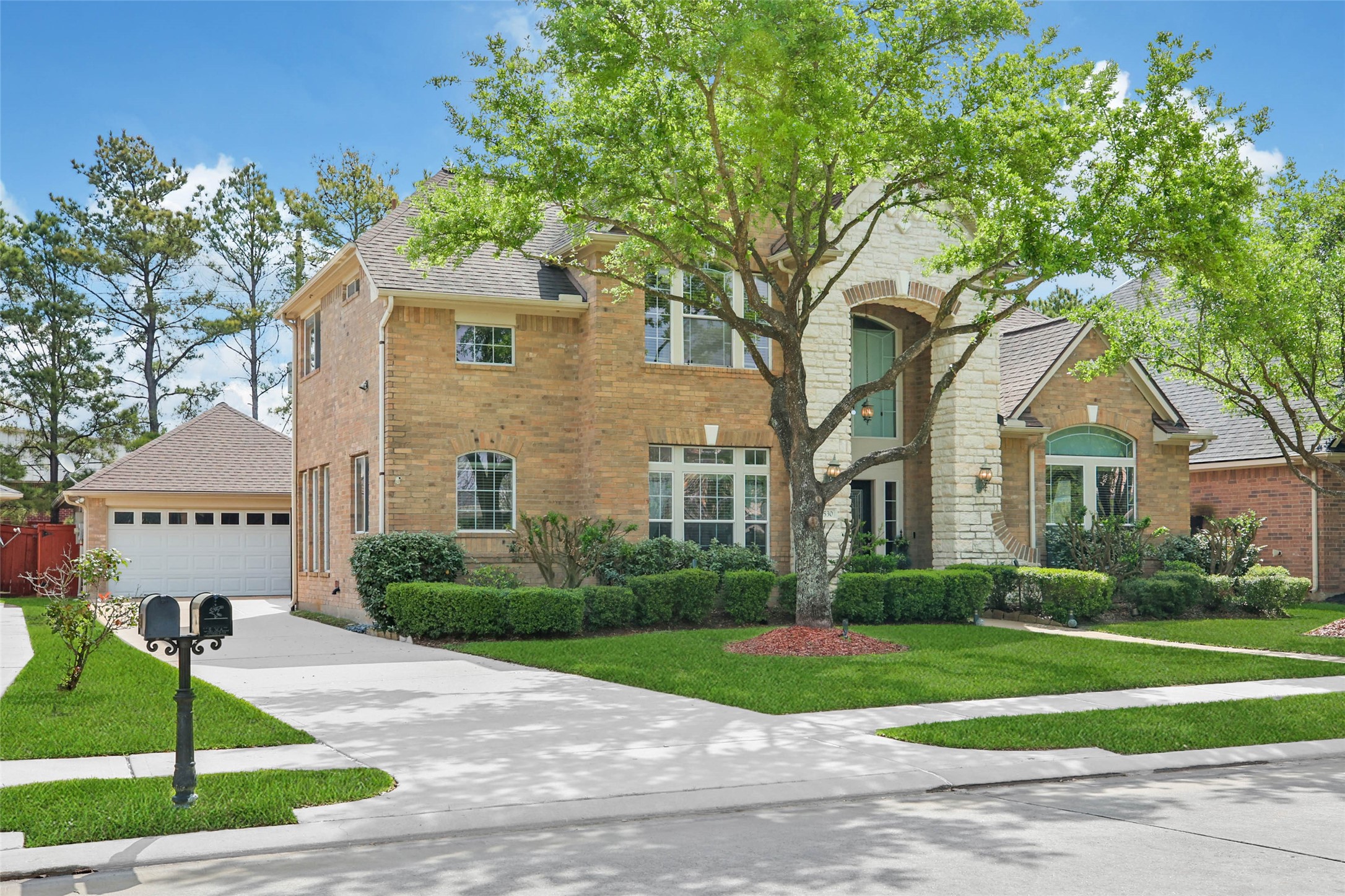 6530 Monte Bello Ridge Lane Houston, TX 77041 - Photo 43 of 43 a front view of a house with a garden