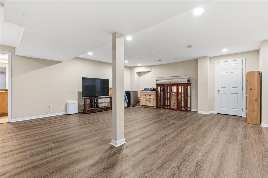 8781 Rupp Farm Drive West Chester, OH 45069 - Photo 40 of 48 This spacious basement offers a versatile living area with durable flooring and ample recessed lighting.
