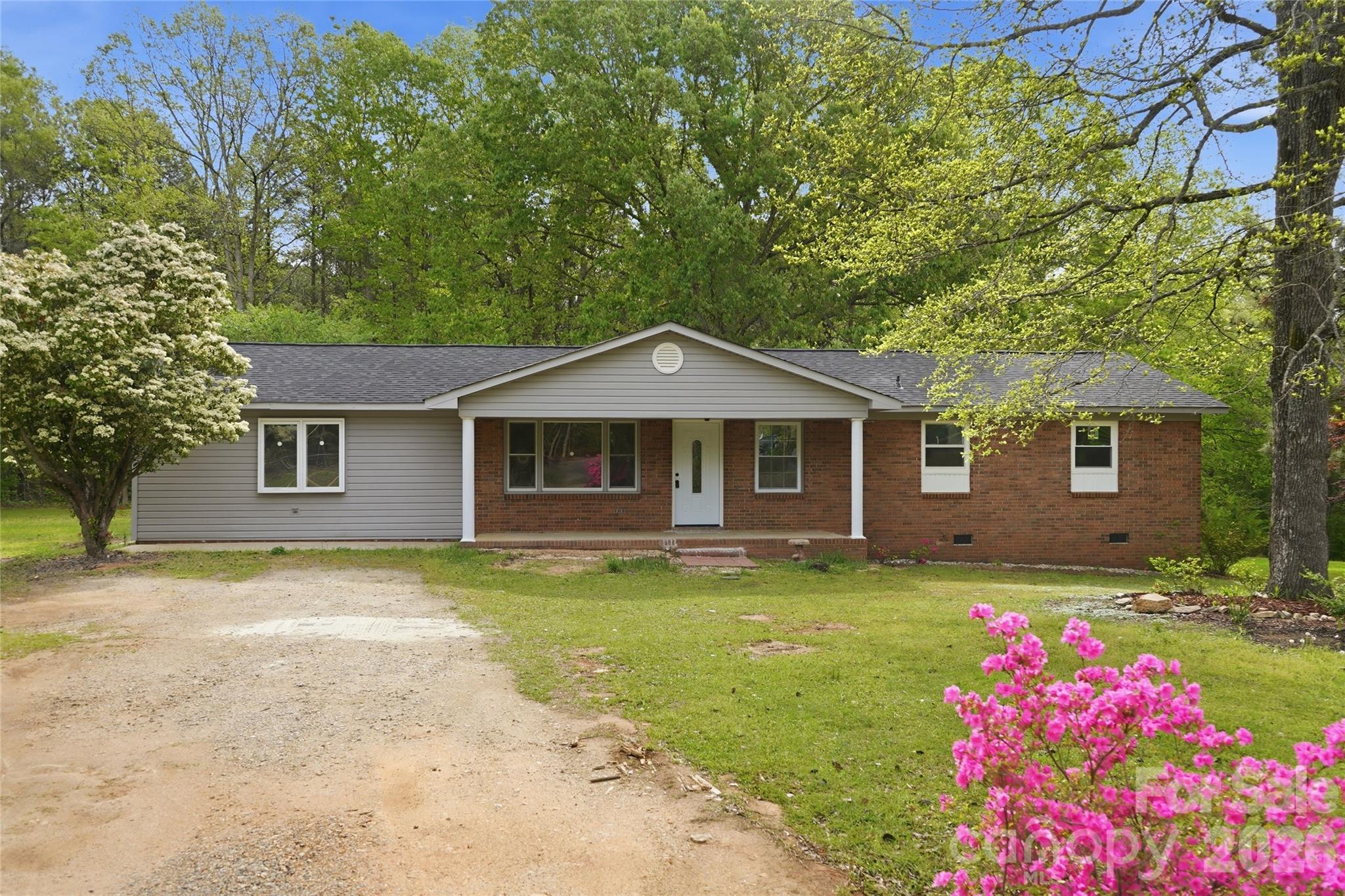 3285 Douglas Way Lane Lancaster, SC 29720 - Photo 1 of 44 a front view of a house with a garden