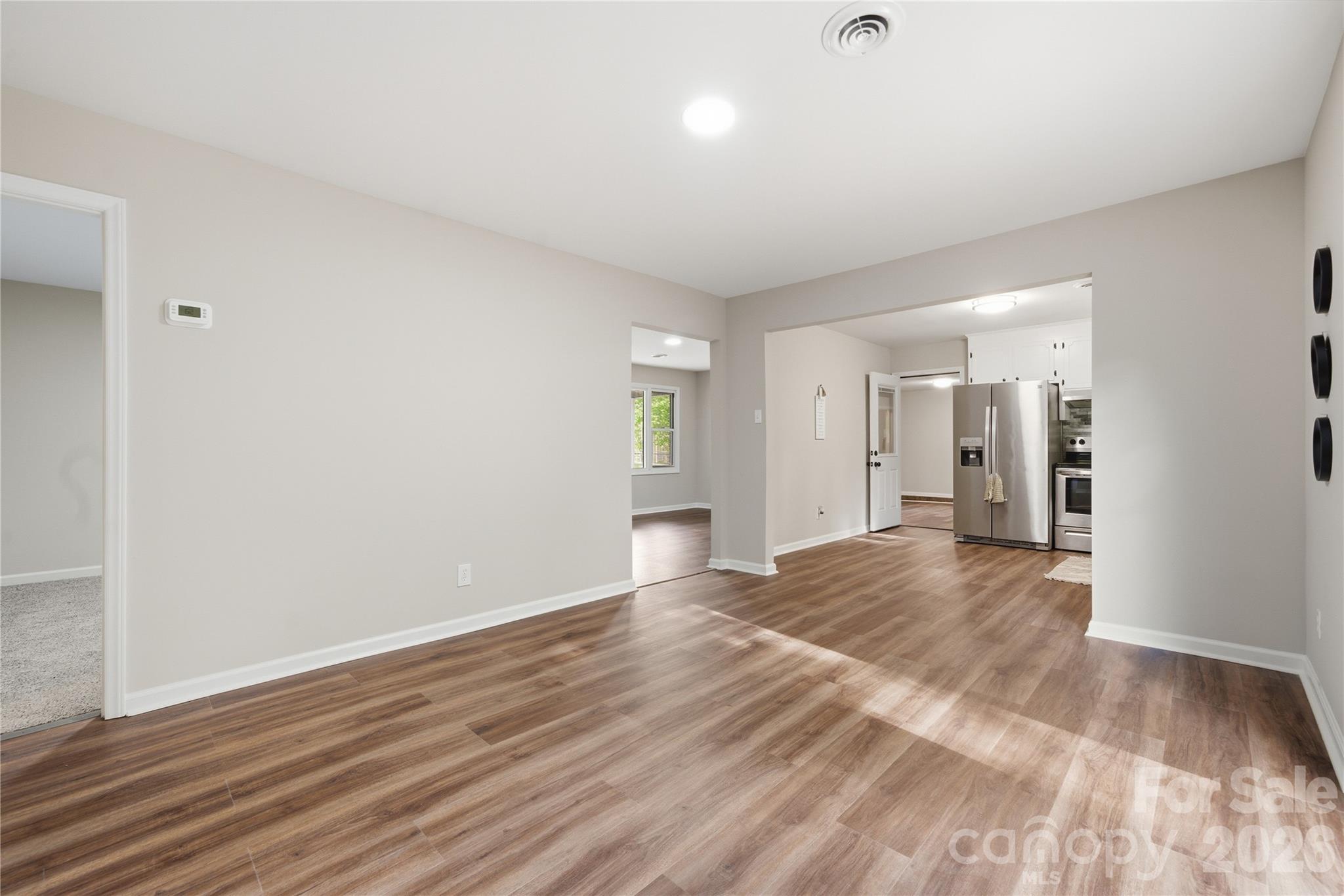 3285 Douglas Way Lane Lancaster, SC 29720 - Photo 13 of 44 a view of an empty room and wooden floor