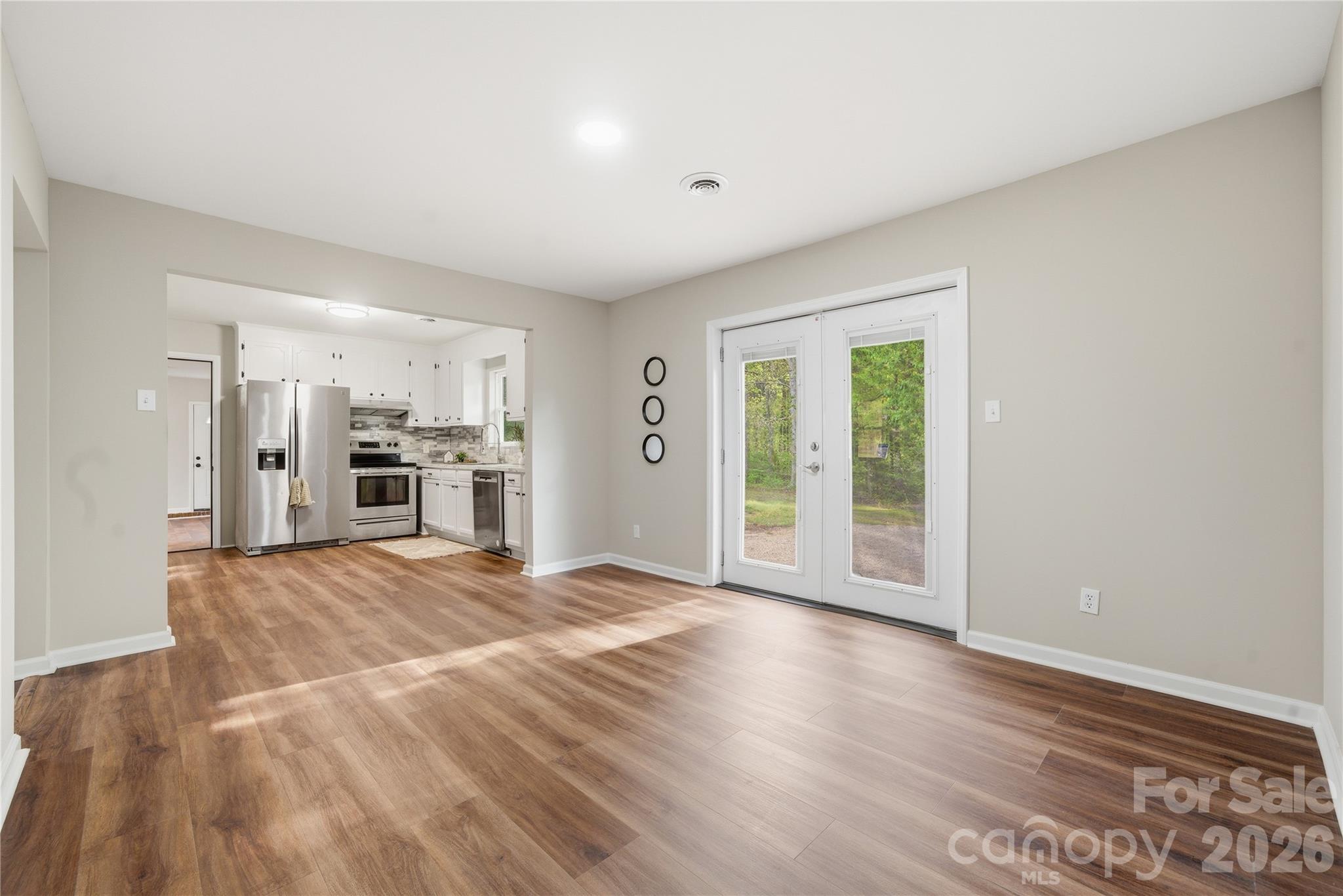 3285 Douglas Way Lane Lancaster, SC 29720 - Photo 14 of 44 a view of an empty room with kitchen and a window