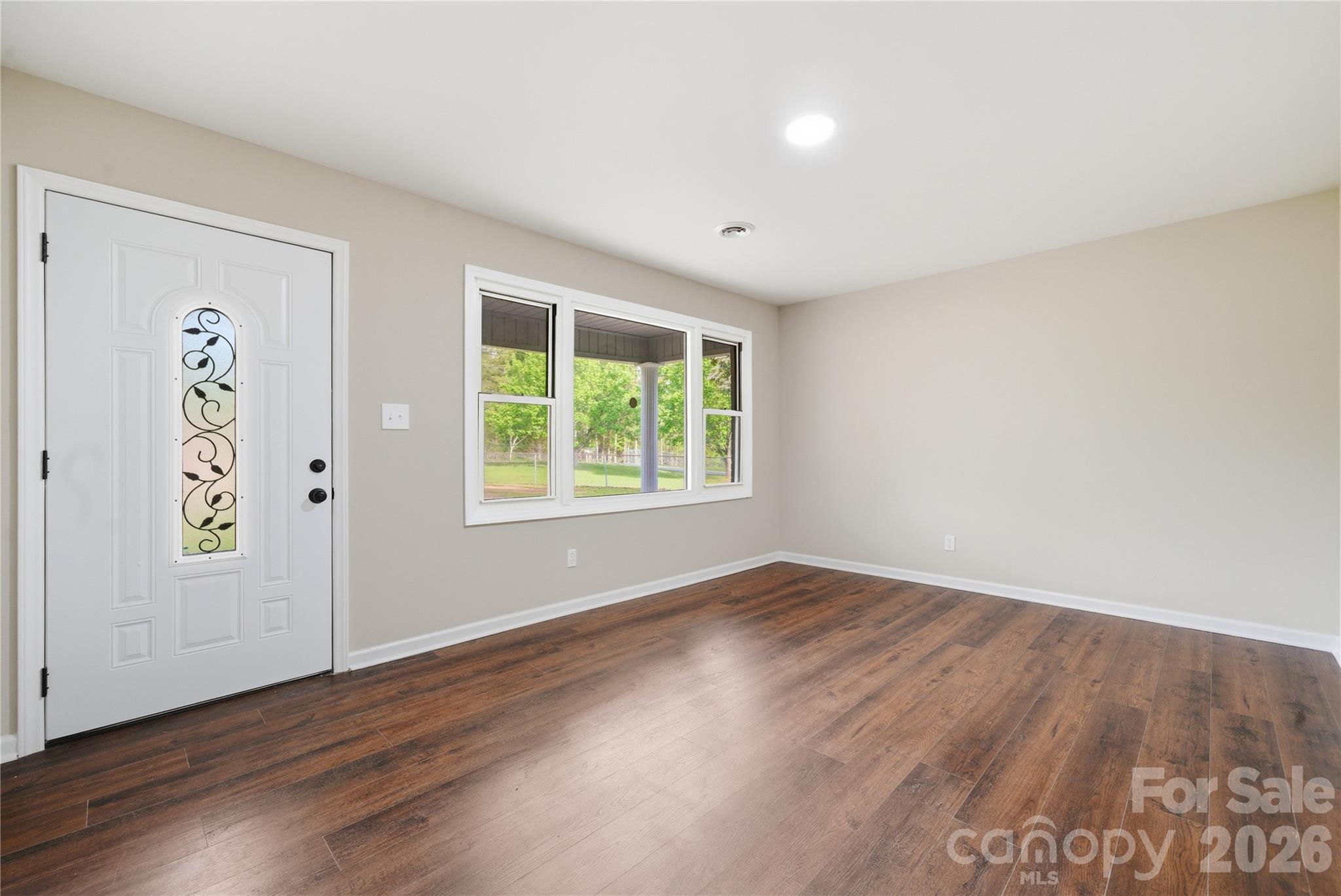 3285 Douglas Way Lane Lancaster, SC 29720 - Photo 8 of 44 an empty room with wooden floor and windows