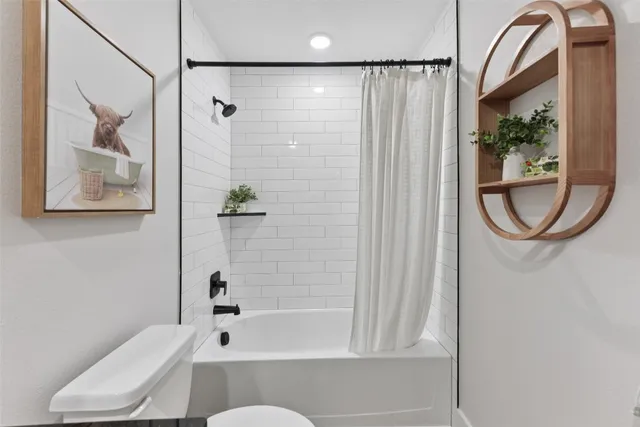 a hallway with table and couch