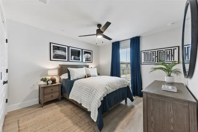 a view of a hallway with a dining table chairs