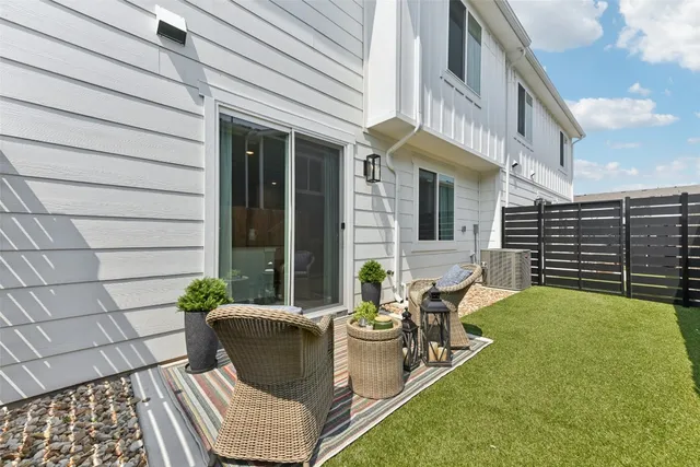a view of a backyard with sitting area