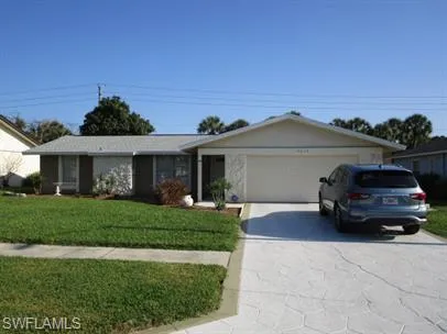 front view of a house with a garden