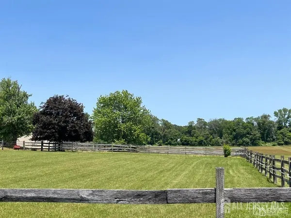 a view of a swimming pool with a yard