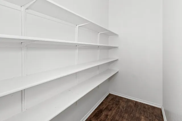 a kitchen sink with a window and kitchen countertops