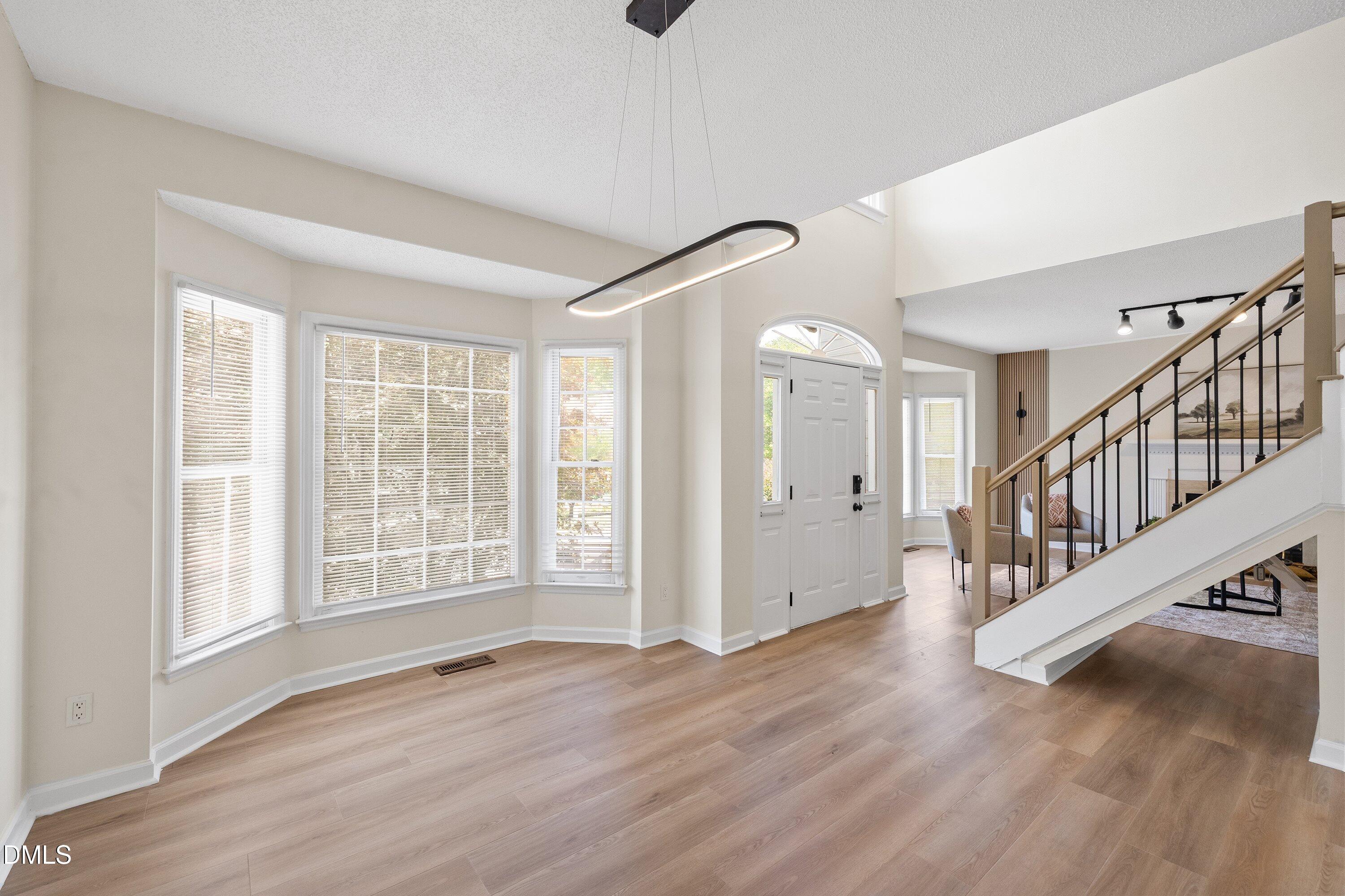 2517 Birchford Court Raleigh, NC 27604 - Photo 10 of 63 a view of an entryway with wooden floor